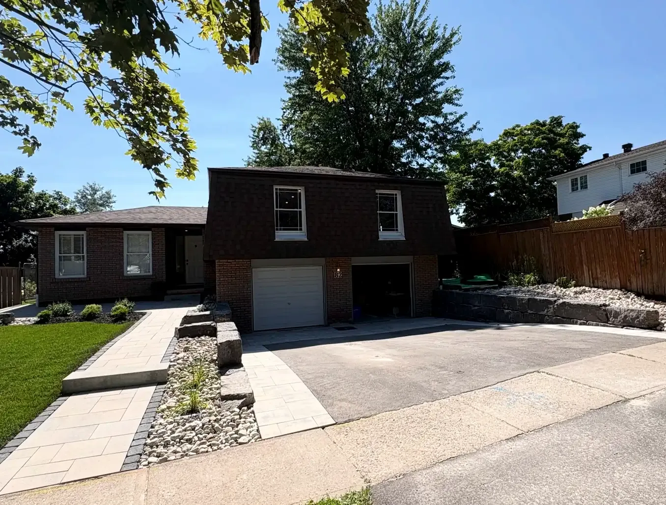 The same property after Blacksmoke rebuilt the walkway, armour stone wall, river rock beds and driveway