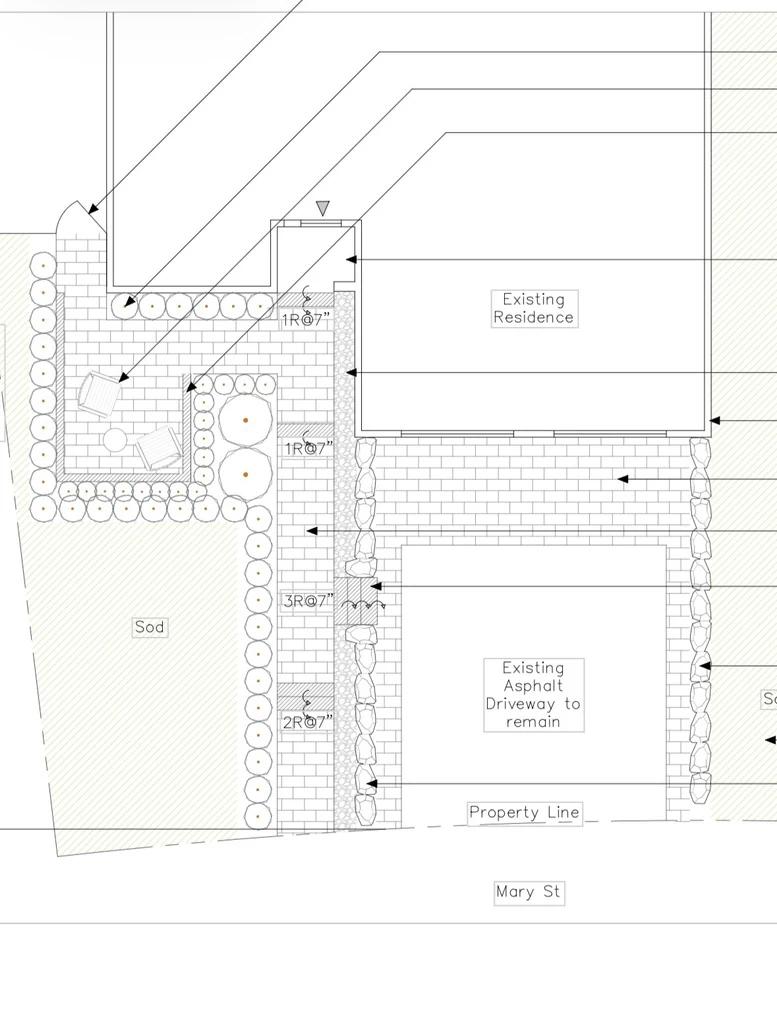 Blacksmoke CAD site plan showing an interlock patio and walkway, armour stone borders and steps around an existing residence and driveway